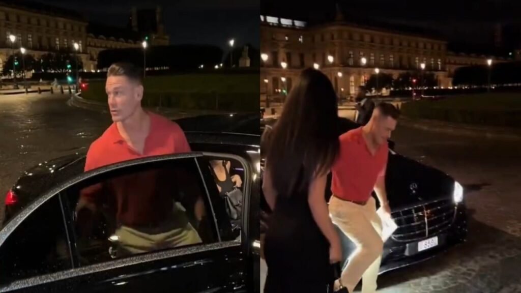جون سينا يرفع زوجته بيد واحدة لكي تتجنب بركة مياه بالطريق.. تغطية