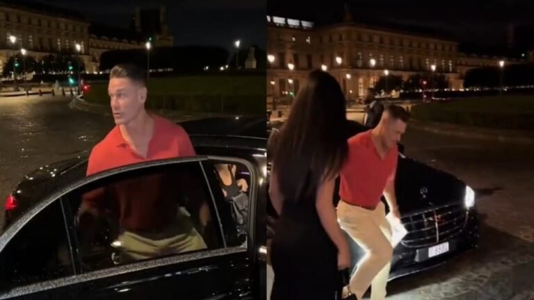 جون سينا يرفع زوجته بيد واحدة لكي تتجنب بركة مياه بالطريق.. تغطية